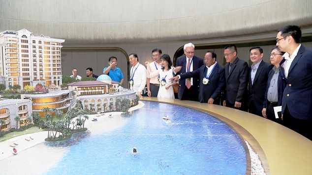 Michael Su of MSK Group Work Inc. (4th from right) shows guests the features of the proposed Triboa Majestic Bay Residences project to be located in the Subic Bay Freeport. With him are former SBMA Chairman Roberto Garcia (5 th  from right), SBMA DA for Seaport Rani Cruz, SBMA Director Stefani SaÃ±o, and SBMA OIC-DA for Business Group Kenneth Rementilla.